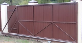 Купить откатные ворота из профнастила Полевской, цена от 1730 руб.