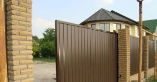 Купить откатные ворота из профнастила Полевской, цена от 1730 руб.